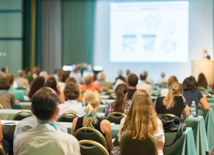 A conference presentation as seen from the audience.